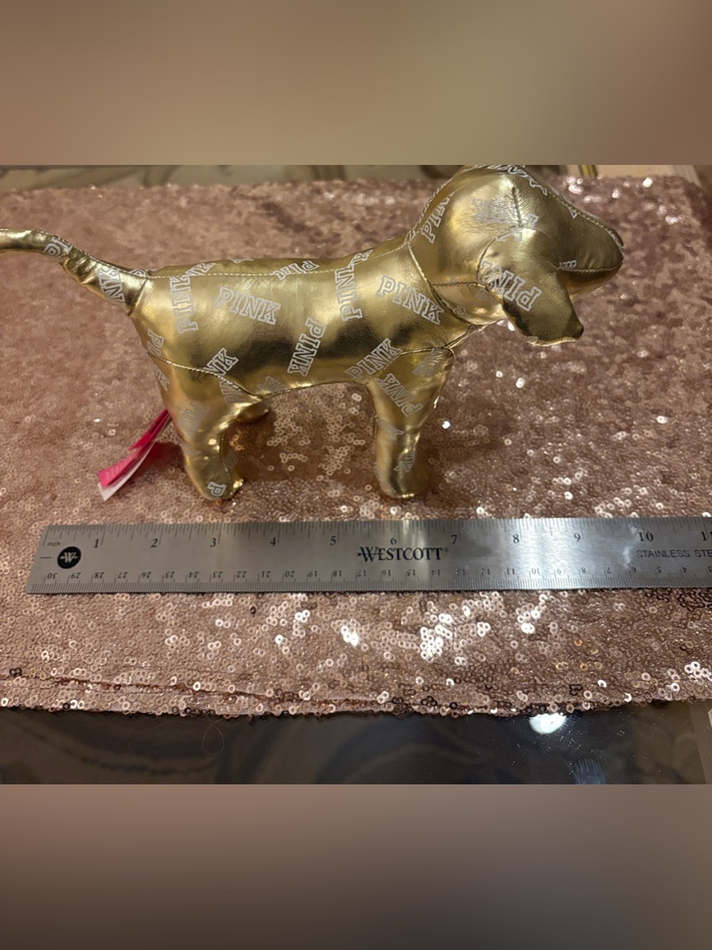 Victoria’s Secret PINK gold metallic dog w/allover logo. 6” high x 10” wide appr